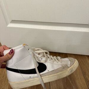 Nike White High-Top Sneakers with Black Swoosh